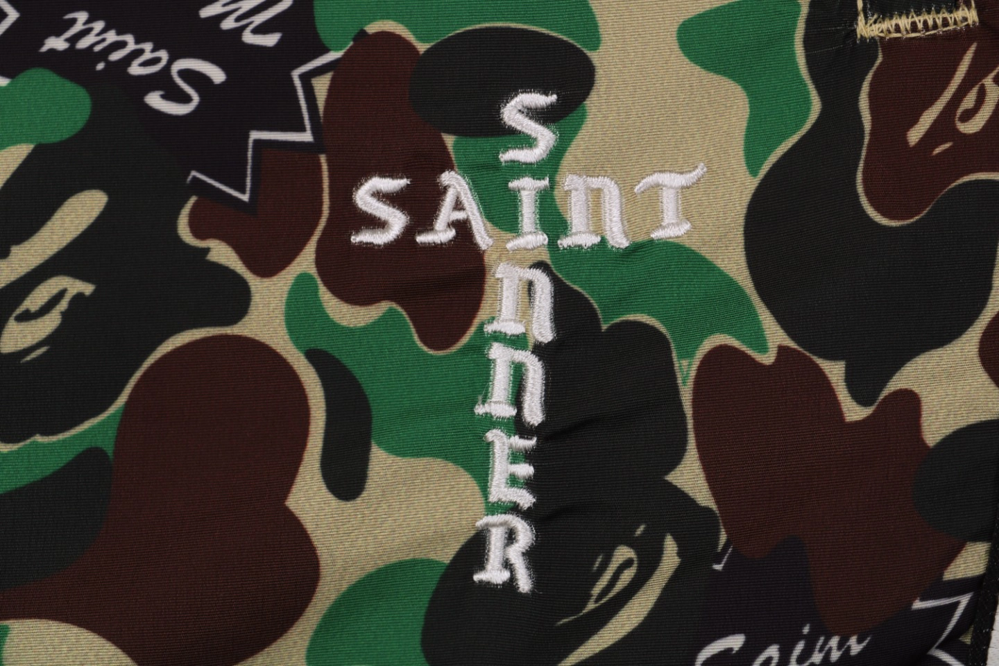 Bape-×-Saint-Michael-Collaborative-Logo-Tape-Camo-Track-Pants4.jpeg.webp Bape X Saint Michael Collaborative Logo Tape Camo Track Pants