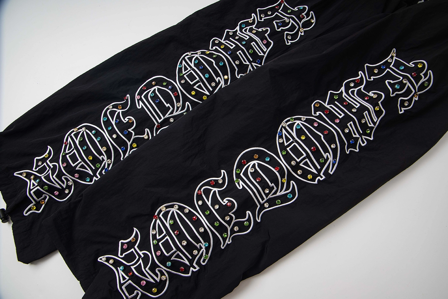 Mixed Emotion Reflective Gothic Script Black Pants