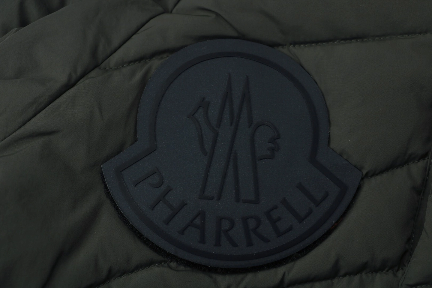 Mxxcler-x-Pharrell-Williams-Oversized-Logo-Puffer-Jacket1.jpeg.webp Mxxcler X Pharrell Williams Oversized Logo Puffer Jacket