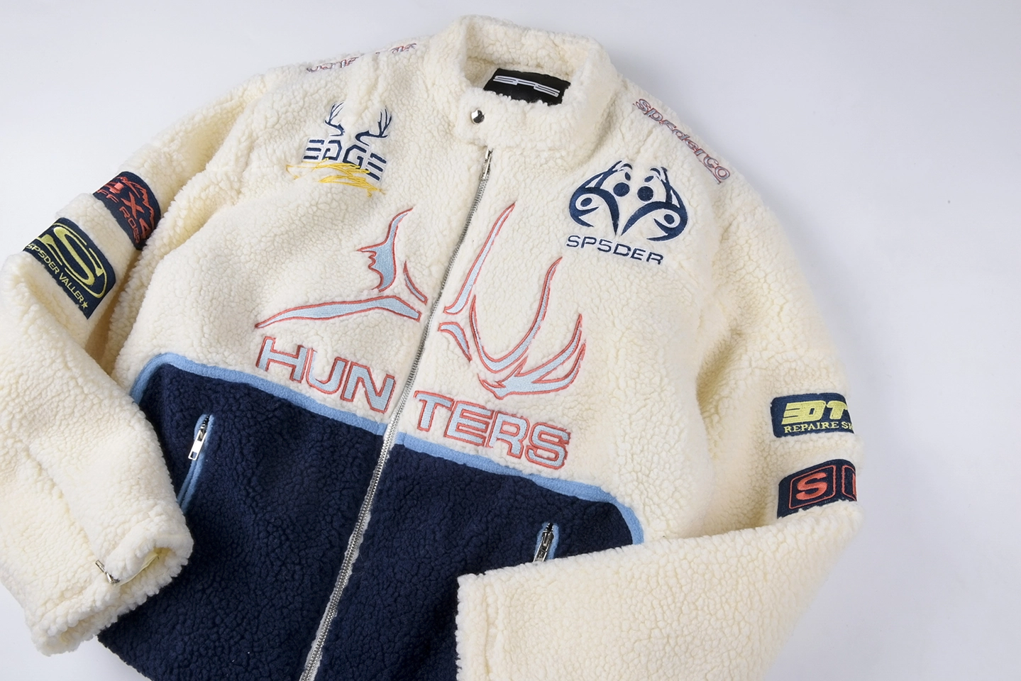 Sp5der-Ivory-Navy-Hunter-Sherpa-Jacket3.webp Sp5Der Ivory Navy Hunter Sherpa Jacket
