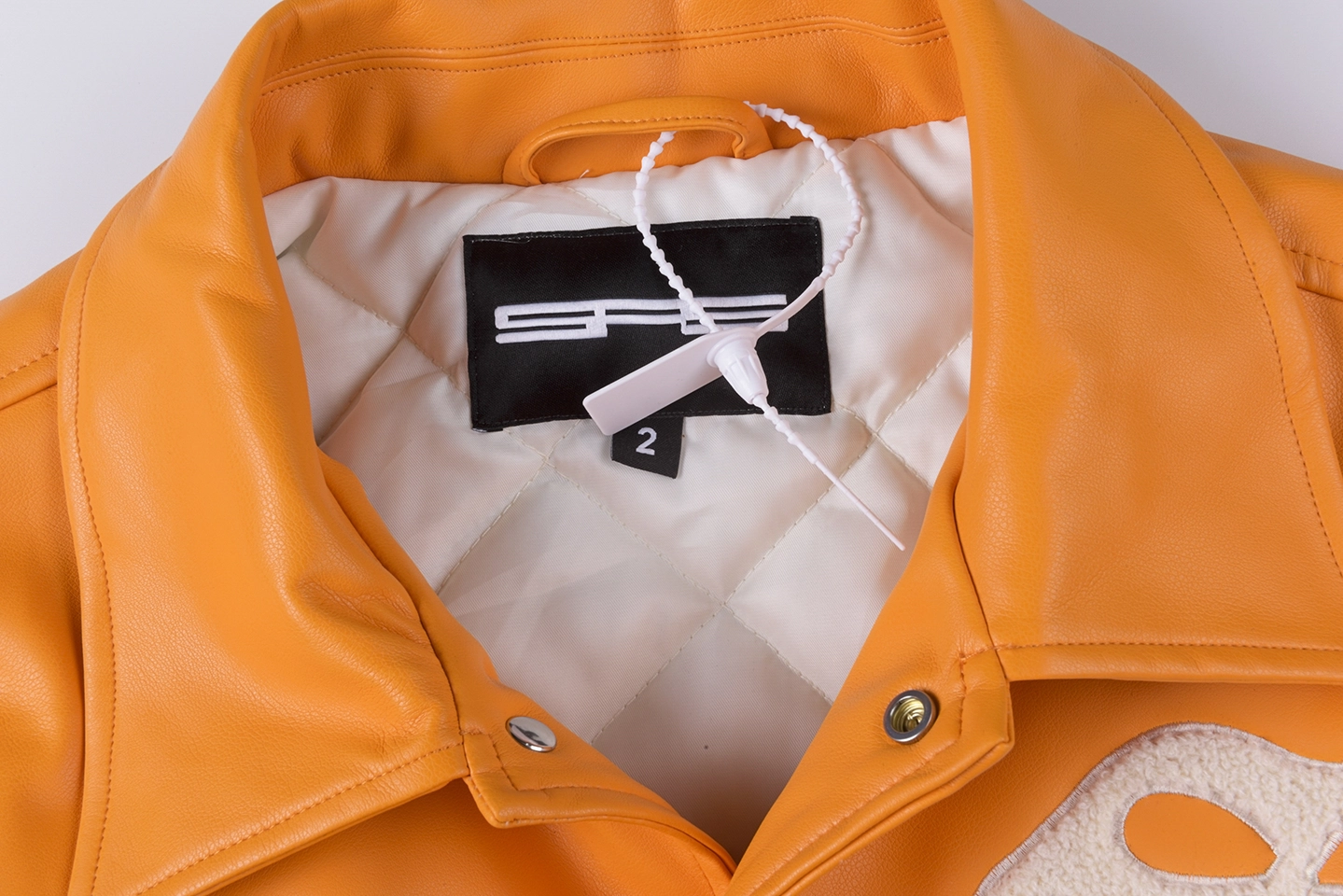 Sp5Der Orange White S Logo Varsity Jacket