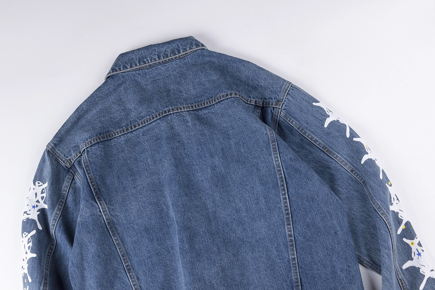 Sp5der-Washed-Blue-Graphic-Sleeve-Denim-Jacket5.webp Sp5Der Washed Blue Graphic Sleeve Denim Jacket