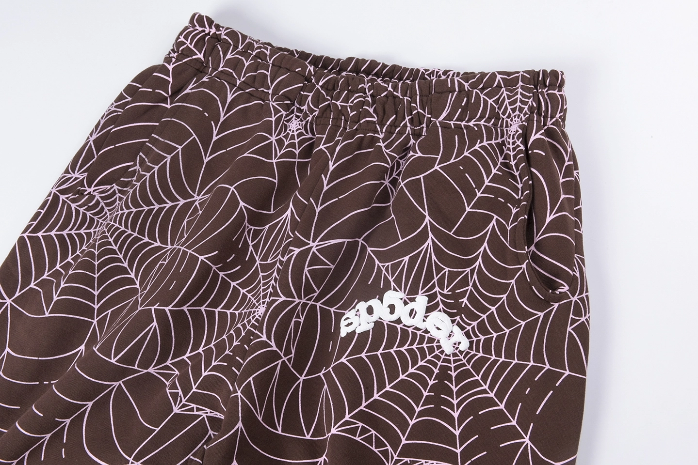 Sp5Der Web Allover Print Brown Sweatpants