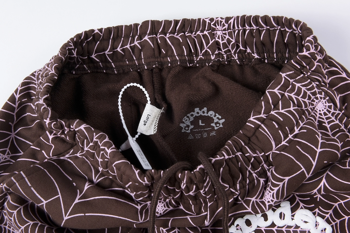Sp5Der Web Allover Print Brown Sweatpants