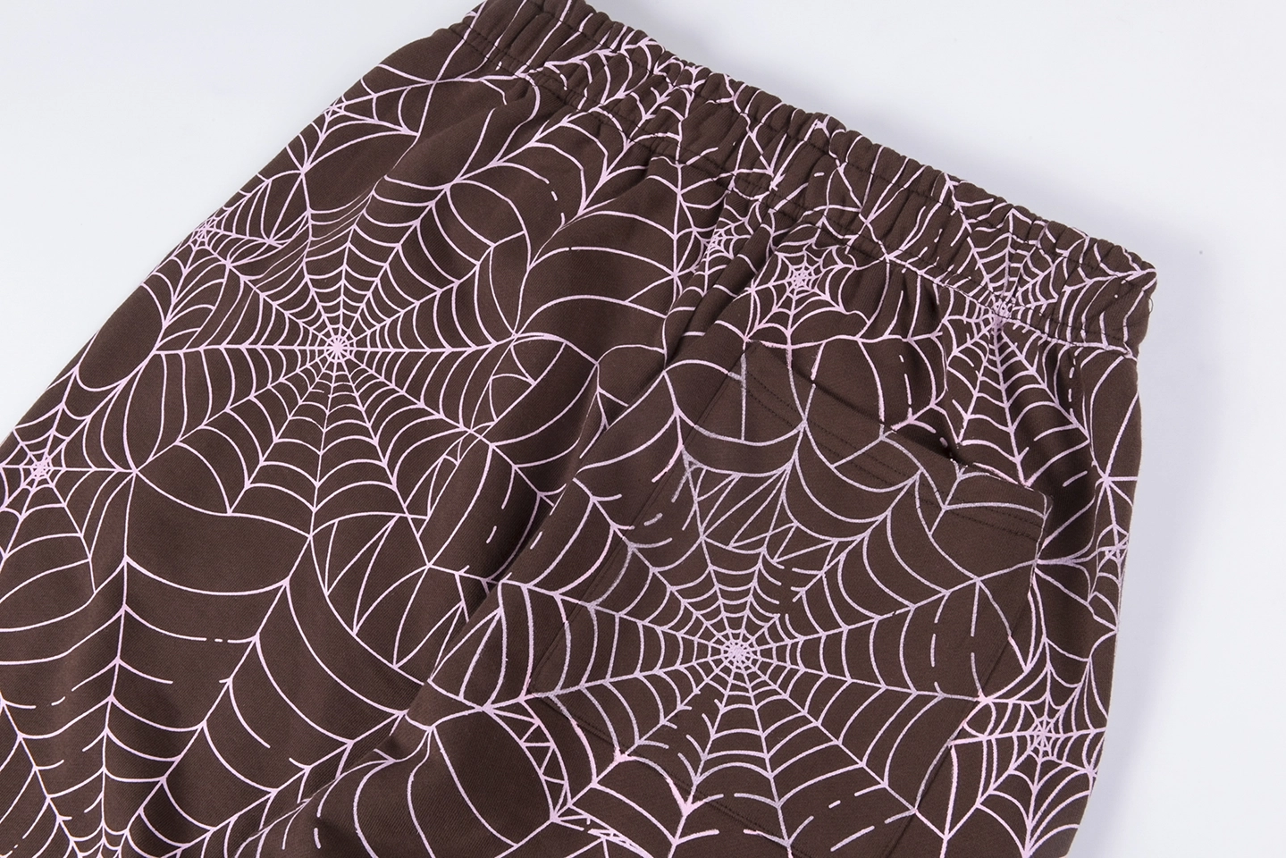 Sp5Der Web Allover Print Brown Sweatpants